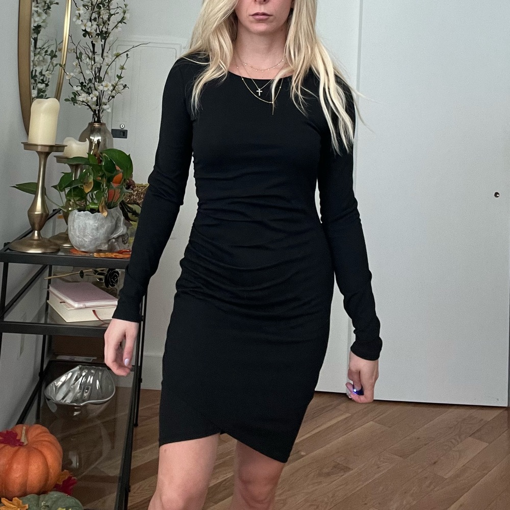 Black leith dress. Asymmetrical hem. Size small.